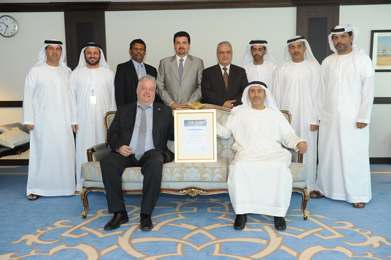 Al Hosn CEO Saif Ahmed Al Ghafli and CSR Company President Martin Neureiter with Dr. Abdul Monem Al Mazooqi and the Al Hosn CSR Management Team